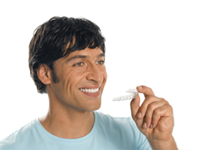 man_inserting_invisalign